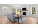 Spacious living room with a fireplace and large windows at 3794 Wynn Walk, Brookhaven, GA 30341