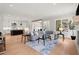 Open living room featuring a comfortable sectional sofa and hardwood floors at 3794 Wynn Walk, Brookhaven, GA 30341