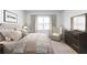 Spacious bedroom with a king-size bed and large windows at 356 Rock View Ln, Covington, GA 30016