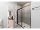 Clean bathroom with a large shower and view into bedroom at 356 Rock View Ln, Covington, GA 30016