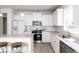 Modern kitchen with stainless steel appliances and granite countertops at 356 Rock View Ln, Covington, GA 30016