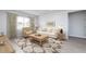 Spacious living room with a beige sofa and a large window at 356 Rock View Ln, Covington, GA 30016