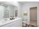 Elegant bathroom with double vanity and a walk-in shower at 356 Rock View Ln, Covington, GA 30016