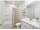 Simple bathroom with a shower/tub combo and white vanity at 356 Rock View Ln, Covington, GA 30016