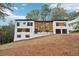 Modern home with wood siding and two-car garage at 2396 Sunset Ne Dr, Atlanta, GA 30345