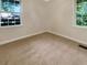 Well-lit bedroom with neutral carpeting and large windows at 828 Pinevalley Dr, Forest Park, GA 30297