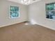 Bright bedroom with neutral carpeting and large windows at 828 Pinevalley Dr, Forest Park, GA 30297