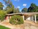 Brick ranch home with carport and landscaping at 828 Pinevalley Dr, Forest Park, GA 30297
