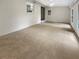 Sunroom with carpeted floor, brick wall, and multiple windows at 828 Pinevalley Dr, Forest Park, GA 30297