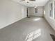 Spacious living room with neutral carpeting at 828 Pinevalley Dr, Forest Park, GA 30297