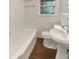 Clean bathroom with a bathtub, toilet, and sink at 828 Pinevalley Dr, Forest Park, GA 30297
