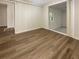 Simple bedroom with wood-look floors and access to closet at 828 Pinevalley Dr, Forest Park, GA 30297