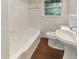 Bathroom with a classic white bathtub and sink at 828 Pinevalley Dr, Forest Park, GA 30297
