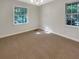 Well-lit bedroom with neutral carpeting and two windows at 828 Pinevalley Dr, Forest Park, GA 30297