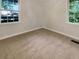 Bright bedroom with neutral carpeting and large windows at 828 Pinevalley Dr, Forest Park, GA 30297