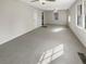 Spacious living room with neutral carpeting and natural light at 828 Pinevalley Dr, Forest Park, GA 30297