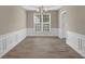 Bright dining room with hardwood floors and wainscoting at 3401 Ravensworth Nw Trce, Kennesaw, GA 30144