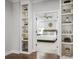 Main bedroom with built-in shelving and a view into the spacious bedroom beyond at 320 Banbury Xing, Alpharetta, GA 30009