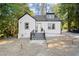Charming white house with gray steps and landscaping at 3775 Clairmont Rd, Chamblee, GA 30341