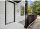 White house exterior with dark gray deck and railings at 3775 Clairmont Rd, Chamblee, GA 30341