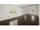 Spacious living room with hardwood floors and large windows at 3775 Clairmont Rd, Chamblee, GA 30341