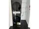 Laundry closet with stacked washer and dryer at 3775 Clairmont Rd, Chamblee, GA 30341