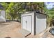 White shed with black trim and double doors at 3775 Clairmont Rd, Chamblee, GA 30341