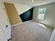 Bedroom with geometric accent wall and neutral carpet at 2452 Brown Dove Way, Grayson, GA 30017