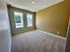 Spacious bedroom with neutral-toned carpeting and walls at 2452 Brown Dove Way, Grayson, GA 30017