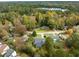 Aerial view of a house nestled in a wooded neighborhood at 1737 Dunbarton Dr, Lithonia, GA 30058