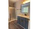 Modern bathroom with gray vanity and walk-in shower at 2827 Candler Sw Run, Marietta, GA 30064