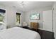 Main bedroom with king-size bed, chair, and plenty of natural light at 3047 Players Dr, Jonesboro, GA 30236