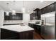 Modern kitchen with dark cabinetry and island at 7736 Rutgers S Cir, Fairburn, GA 30213