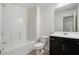 Clean bathroom with a shower/tub combo, toilet and dark vanity at 7736 Rutgers S Cir, Fairburn, GA 30213