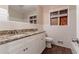 Clean bathroom with granite countertop and white cabinets at 2648 Cavalier Dr, Decatur, GA 30034