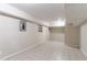 Finished basement with tile flooring and neutral walls at 2648 Cavalier Dr, Decatur, GA 30034