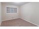 Simple bedroom with neutral walls and brown carpeting at 2648 Cavalier Dr, Decatur, GA 30034