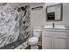 Modern bathroom with marble shower and vanity at 6 Ivy St, Canton, GA 30114