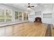 Gathering room with hardwood floors, a fireplace, and built-in shelving at 1624 Climbing Rose Nw Ct, Kennesaw, GA 30152