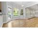 Breakfast nook with hardwood floors, built-in shelving and a view to the backyard at 1624 Climbing Rose Nw Ct, Kennesaw, GA 30152