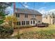 Two-story house exterior with a deck and landscaping at 1624 Climbing Rose Nw Ct, Kennesaw, GA 30152