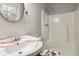 Clean bathroom featuring a shower and pedestal sink at 117 Neal Ave, Stockbridge, GA 30281