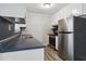 Efficient kitchen featuring stainless steel appliances and white cabinetry at 117 Neal Ave, Stockbridge, GA 30281