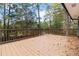 Large deck with wooded backdrop at 117 Neal Ave, Stockbridge, GA 30281