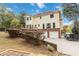 Two-story house with attached garage, deck and landscaping at 9070 Twelvestones Dr, Roswell, GA 30076