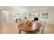 Bright dining area with hardwood floors and a wood table, perfect for Gathering meals at 6107 Phillip Ln, Lithonia, GA 30058