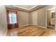 Bright bedroom featuring hardwood floors and an ensuite bathroom at 6687 Hill Creek Cv, Lithonia, GA 30058