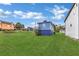 Spacious backyard with a blue house and grassy area at 406 Elm Nw St, Atlanta, GA 30314