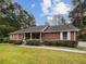 Brick ranch house with landscaping and driveway at 1583 Thornwood Dr, Jonesboro, GA 30236