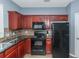 Kitchen with black appliances and granite countertops at 149 Ellis Dr, Conyers, GA 30012